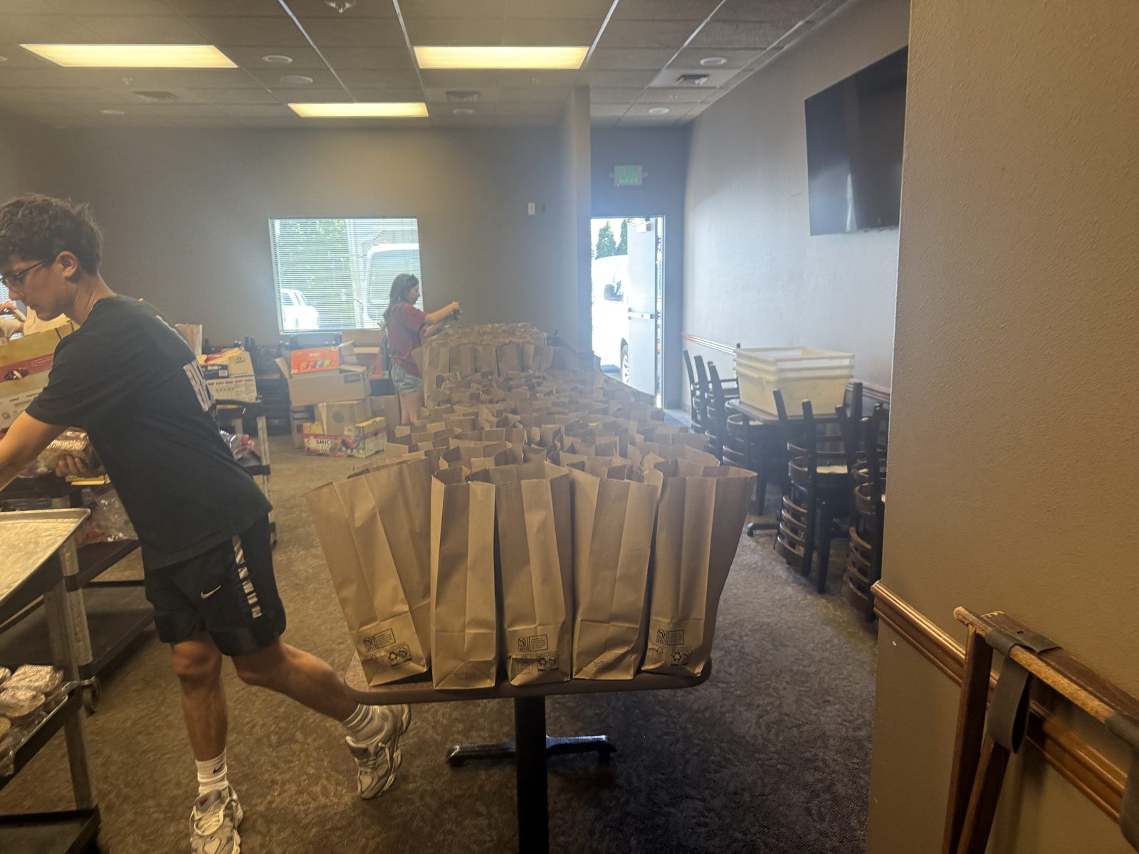 Dozens of sack lunches lined up in-house and ready to load into the CG Public House & Catering van for delivery to wildfire crews